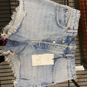 Light denim shorts from Zara. Brand new and never worn. Size 4.